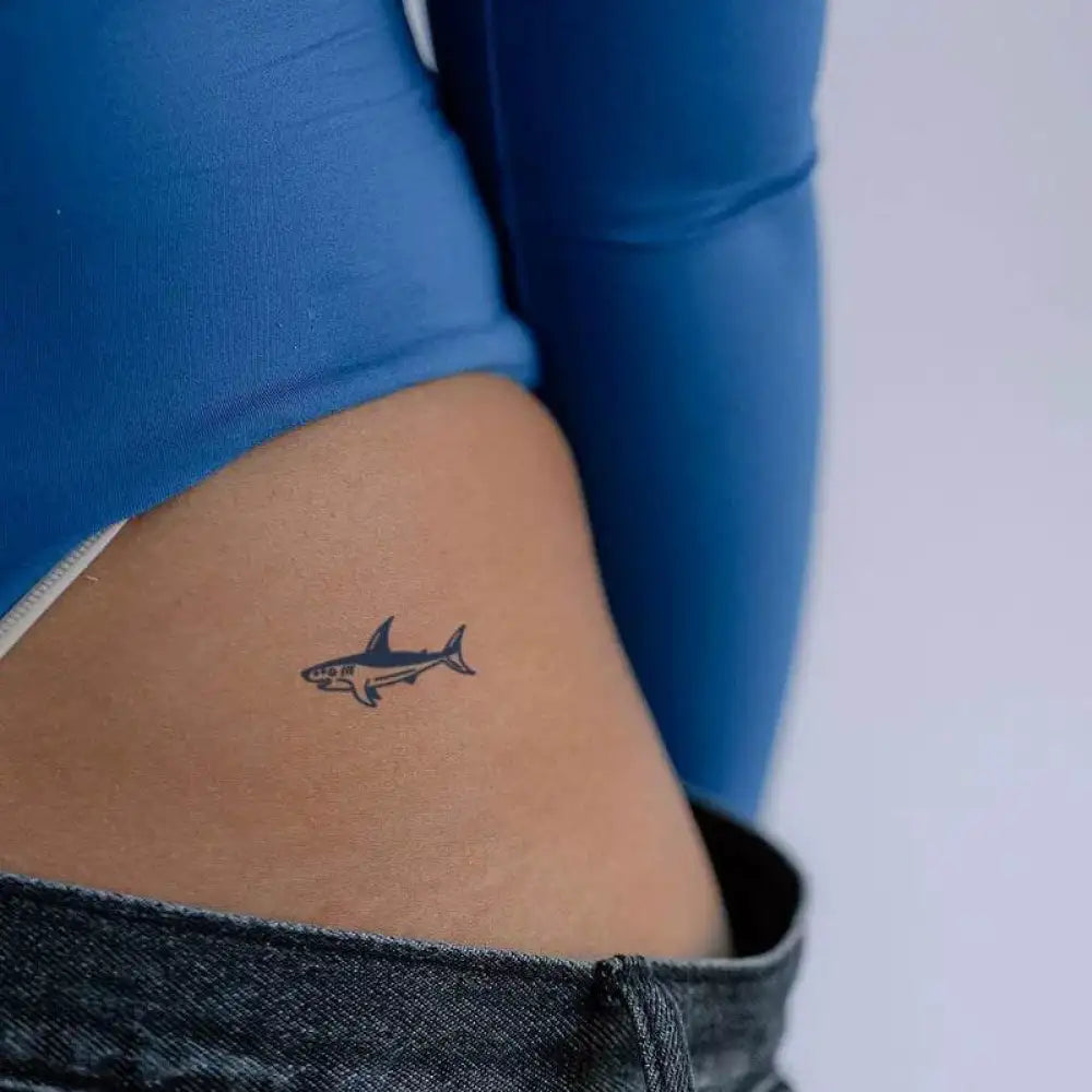 Small dark blue shark tattoo sticker on hip from Gentle Baby Whale Tattoo Sticker Collection with real reviews