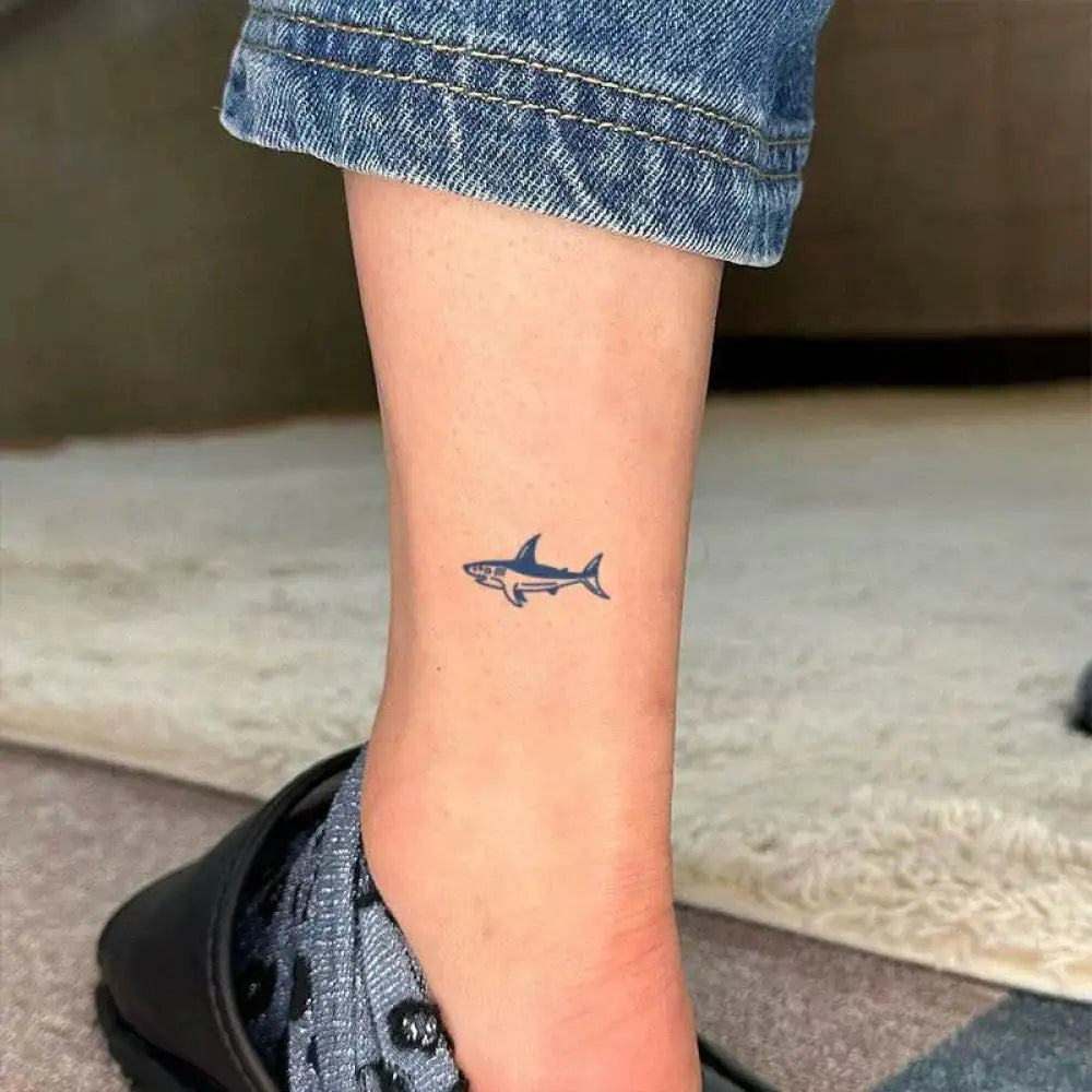 Dark blue shark tattoo sticker on ankle from Gentle Baby Whale Tattoo Sticker Collection with real reviews