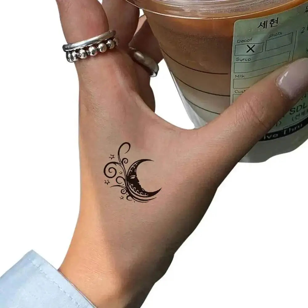 Temporary crescent moon tattoo sticker on hand from Moon’s Kiss 4x5cm, praised in real reviews