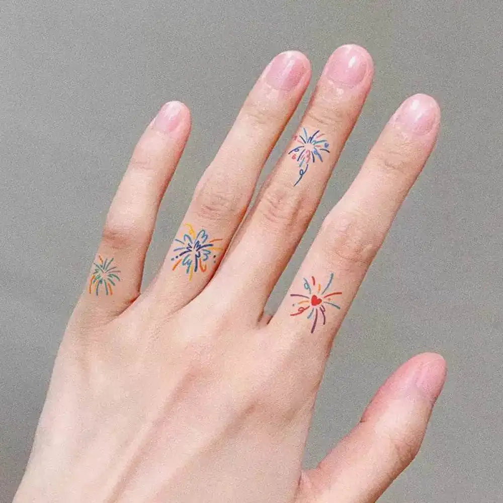 Hand with colorful firework small tattoo sticker on fingers