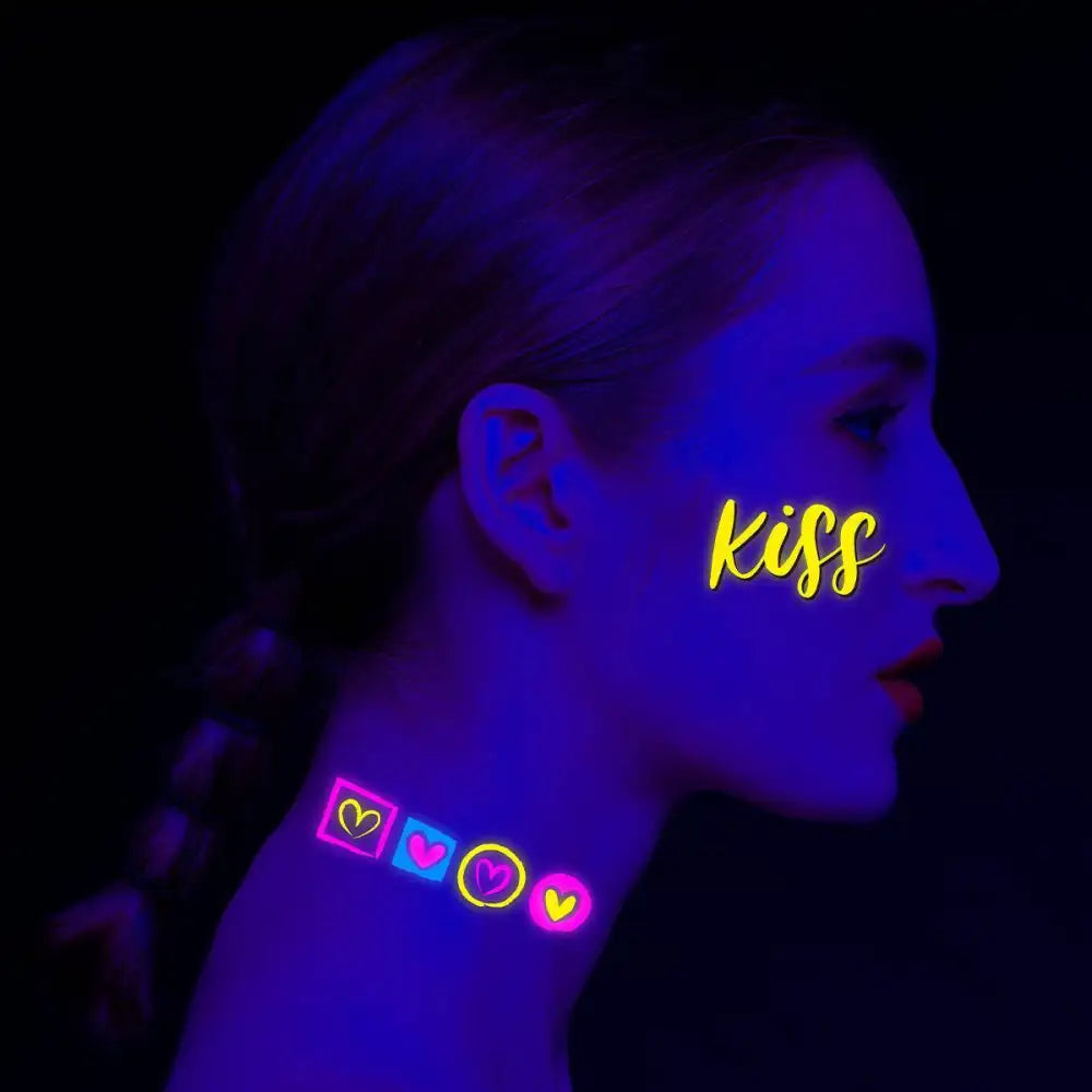 Dark Graffiti AX Fluorescent temporary tattoos on face and neck with glowing kiss text and hearts