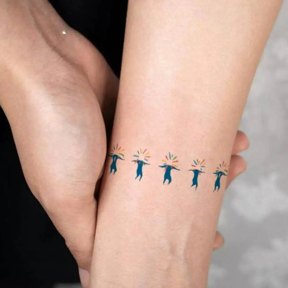 Blue cartoon tattoo sticker with rainbow bursts, featured in Joyful Luna Radiance product