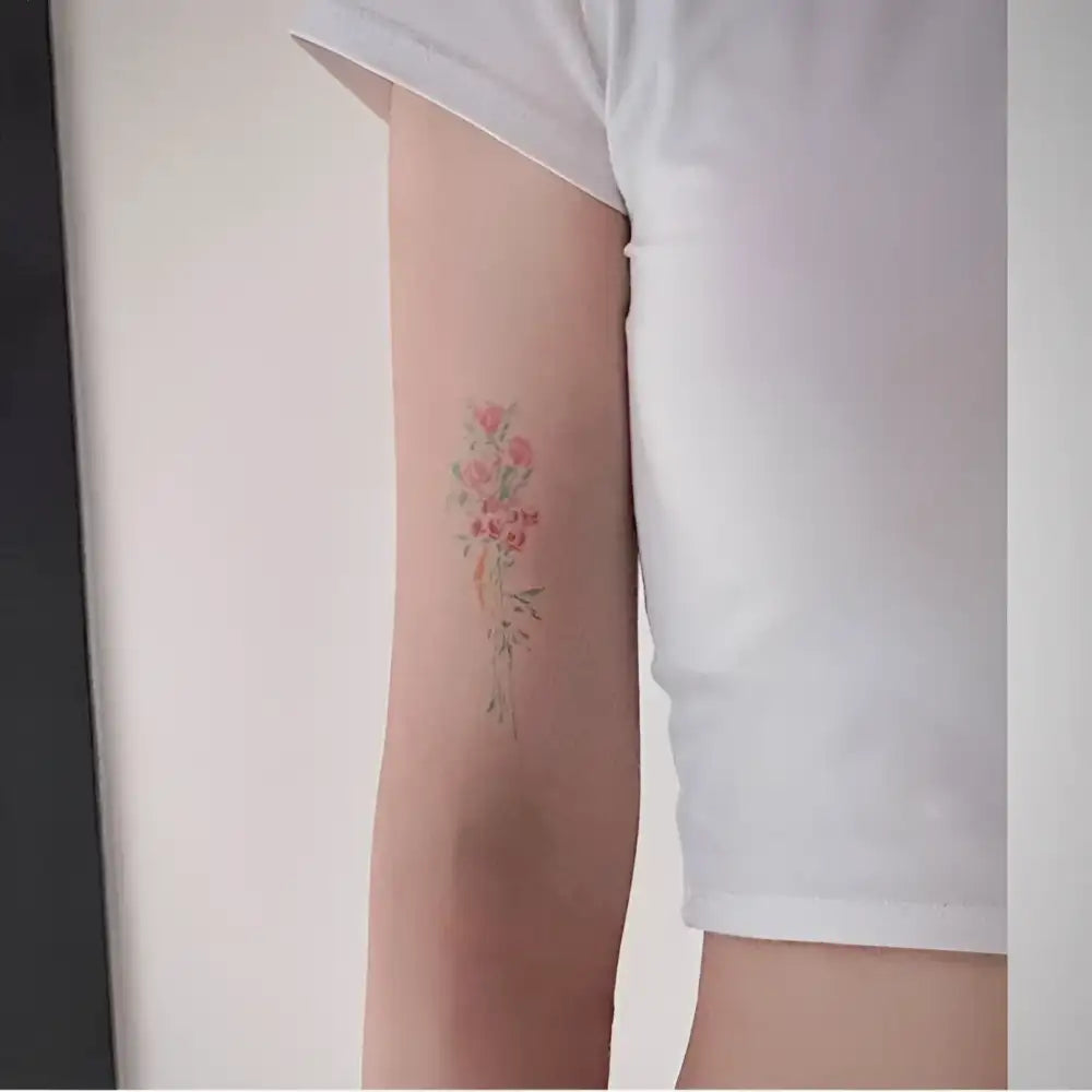 Luna Bloom tattoo sticker featuring delicate floral design with pink and green hues