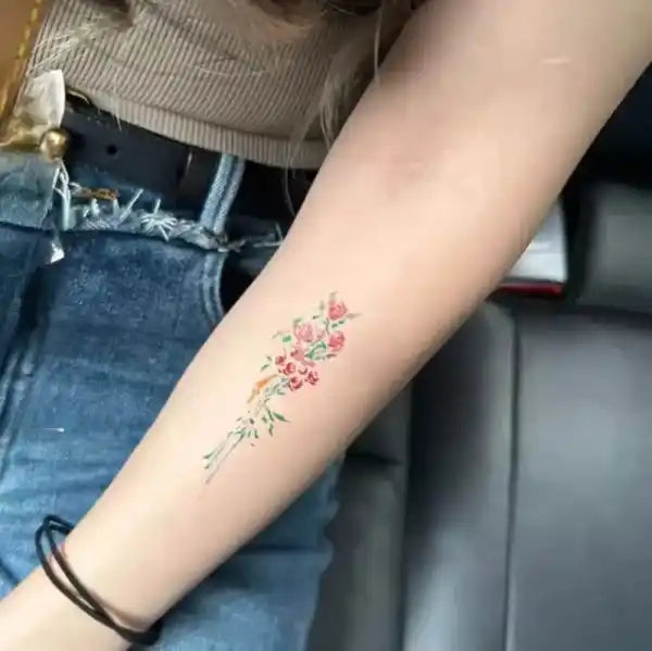 Luna Bloom tattoo sticker featuring a colorful floral bouquet design with real reviews