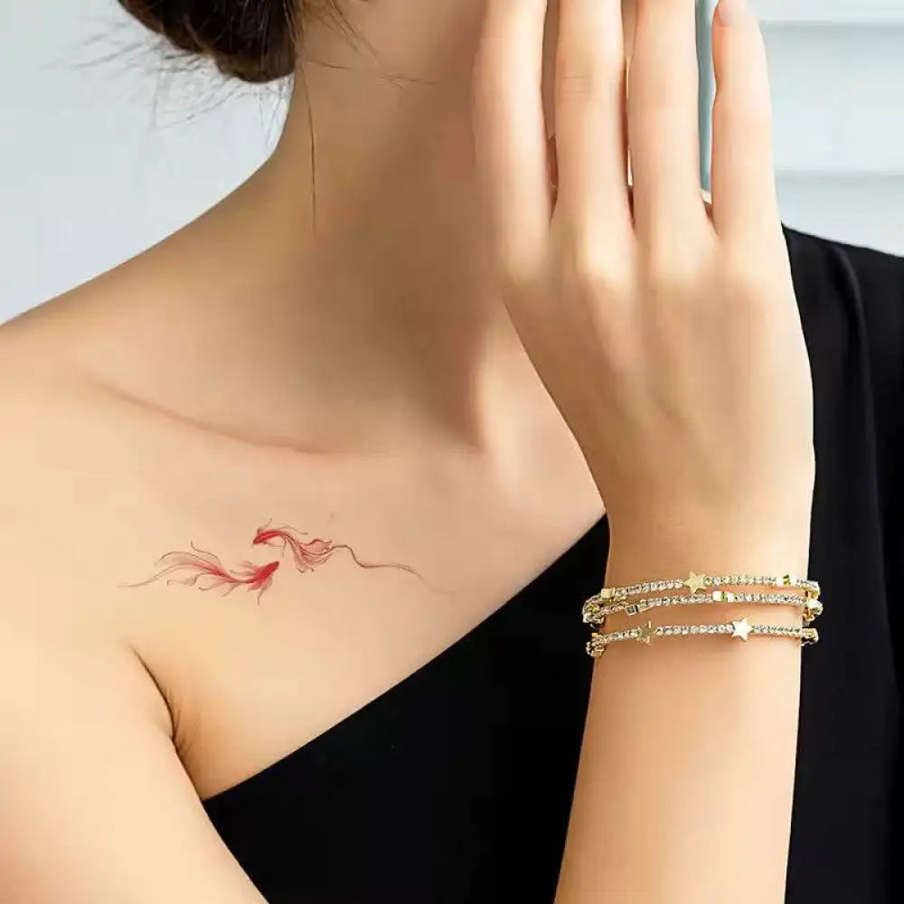 Mermaid Dreams tattoo sticker featuring red fish design and star bangles, real reviews