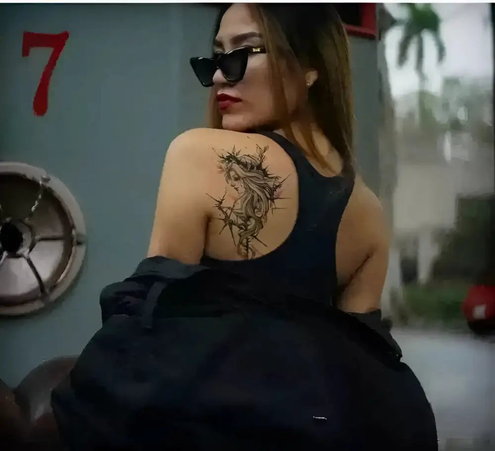 Woman with Ribbon Goddess temporary tattoo in collaboration edition