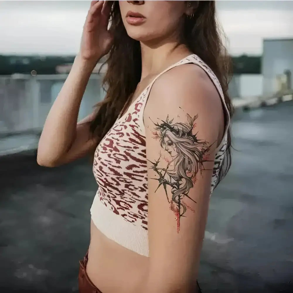 Woman’s Ribbon Goddess temporary tattoo on upper arm, collaboration edition