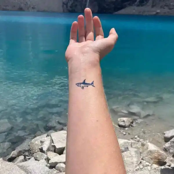 Forearm with small baby whale tattoo sticker from Gentle Baby Whale Tattoo Collection with real reviews