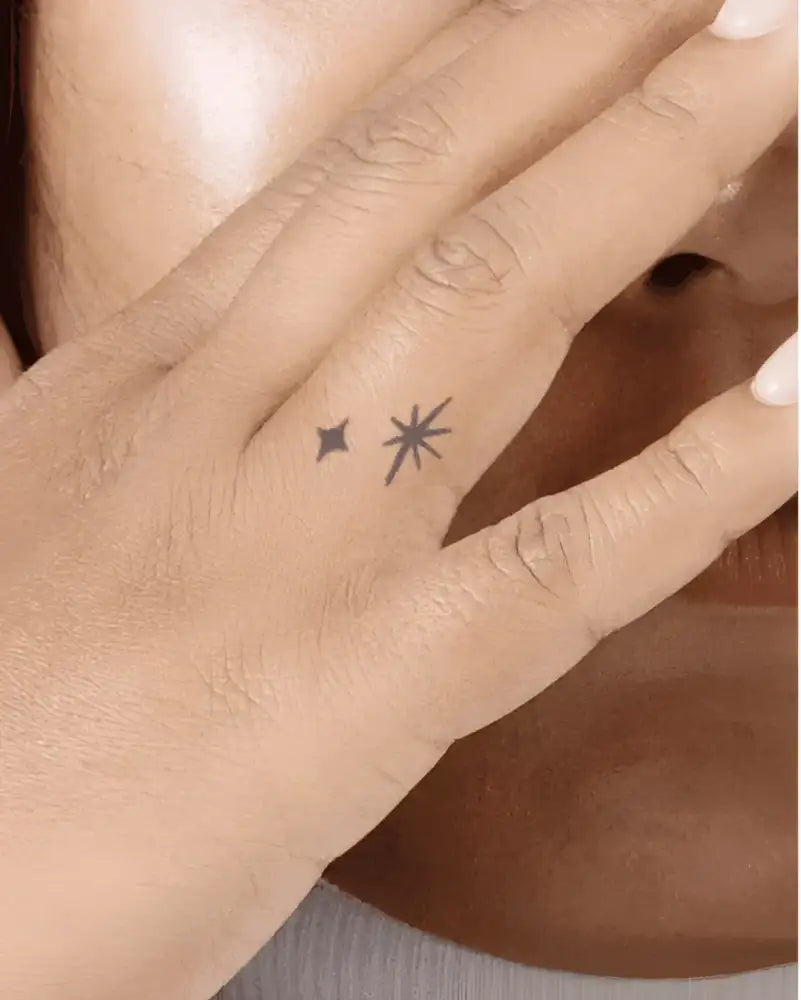 Hand with two small star tattoos from Celestial Tattoo Sticker Collection Under Branches Light Moon with real reviews