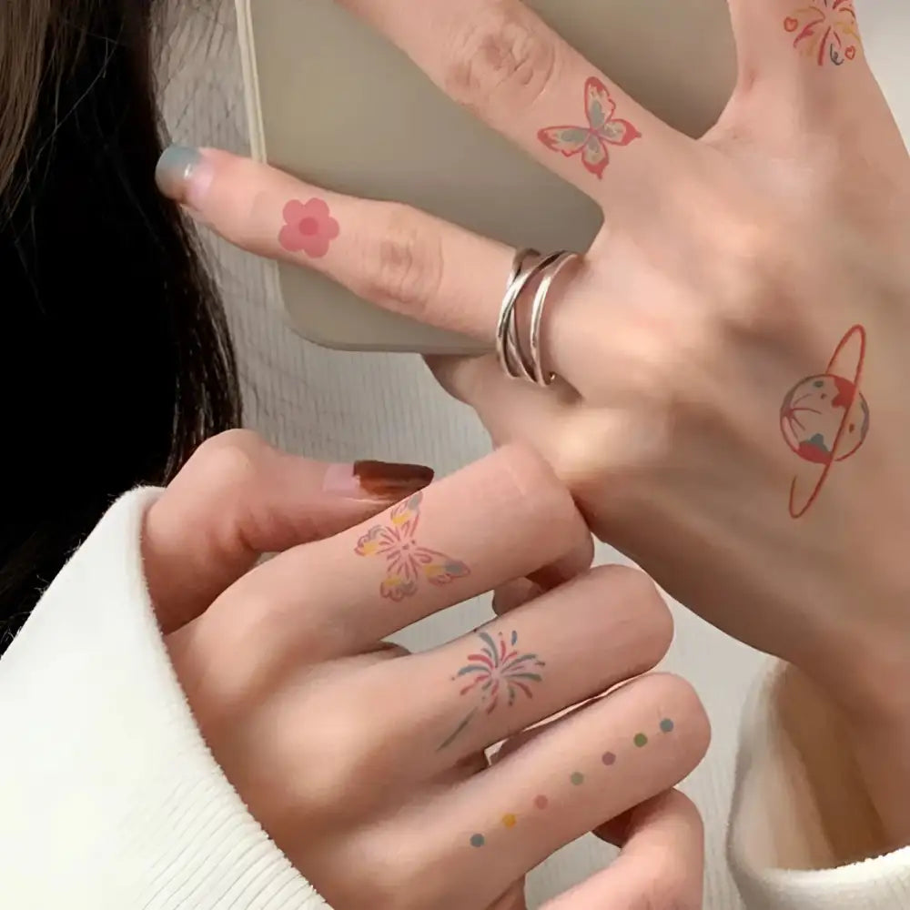 Silver multi-ring fingerless glove with small tattoo sticker designs