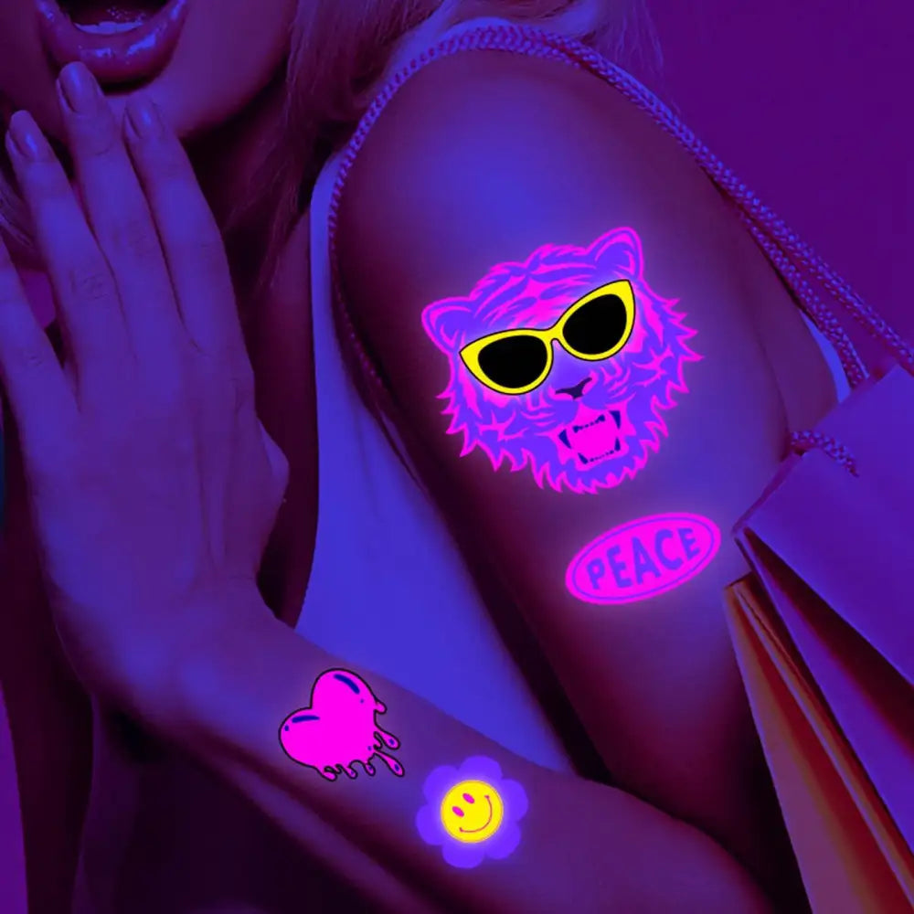 Dark Graffiti GL fluorescent temporary tattoos glowing on arms