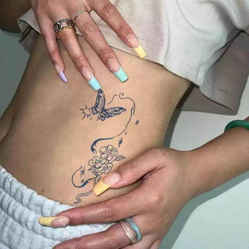 Ephemeral Bloom tattoo sticker featuring floral and butterfly design with pastel nails and jewelry