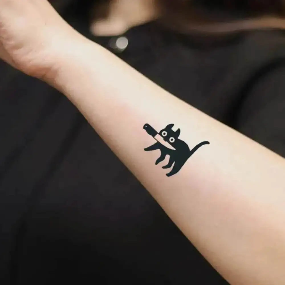 Feline Follies Ink tattoo sticker featuring a black cat holding a knife with real reviews