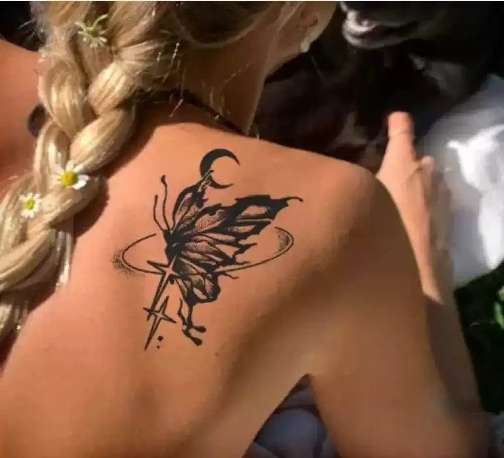 Black butterfly and star tattoo sticker on fair skin from Flower Dance real reviews