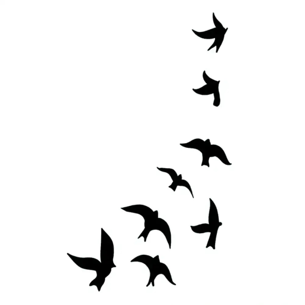 Silhouettes of flying birds flock in tattoo sticker design