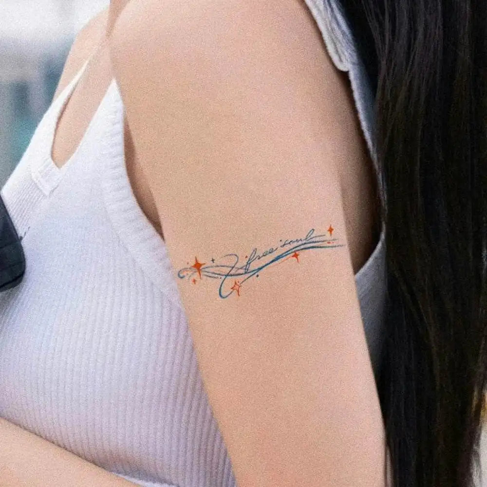 Free Soul temporary tattoo on arm with cursive text, red stars, blue lines, 8.2 x 2.3 cm