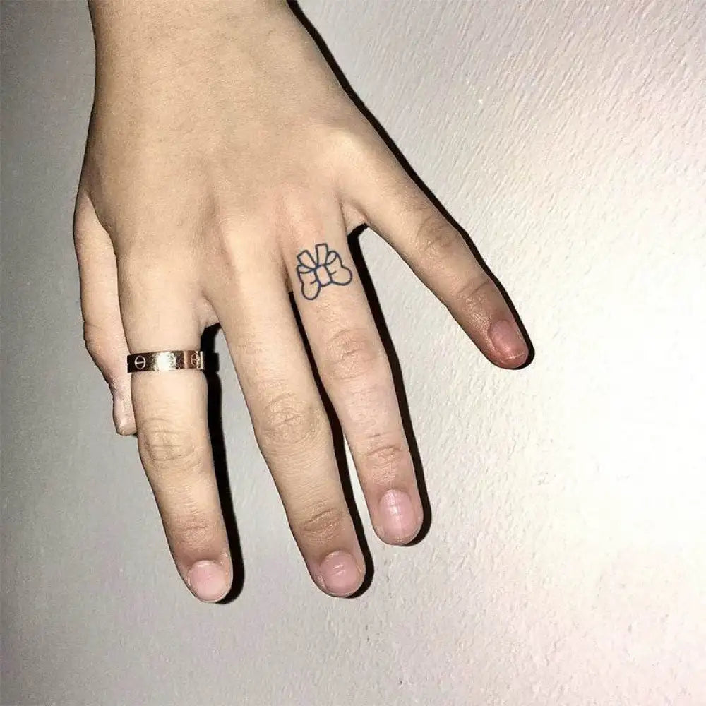 Hand with gold ring and bow tie heart and happy face hand art collection tattoo