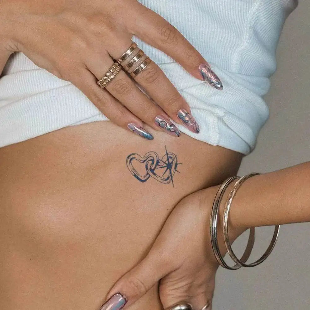 Loving Stars tattoo sticker featuring an advanced hand-drawn design on a woman’s torso