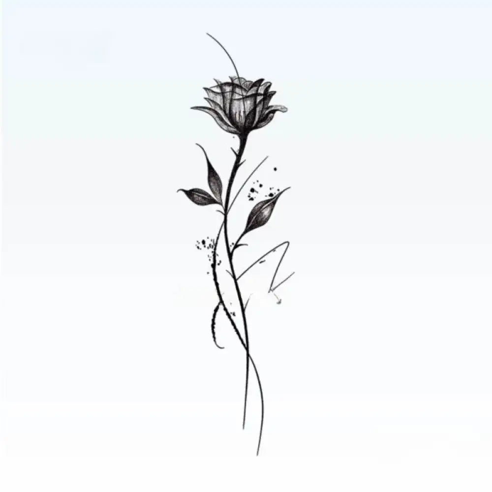 Black and white rose tattoo sticker design with thorny stem and ink splatters