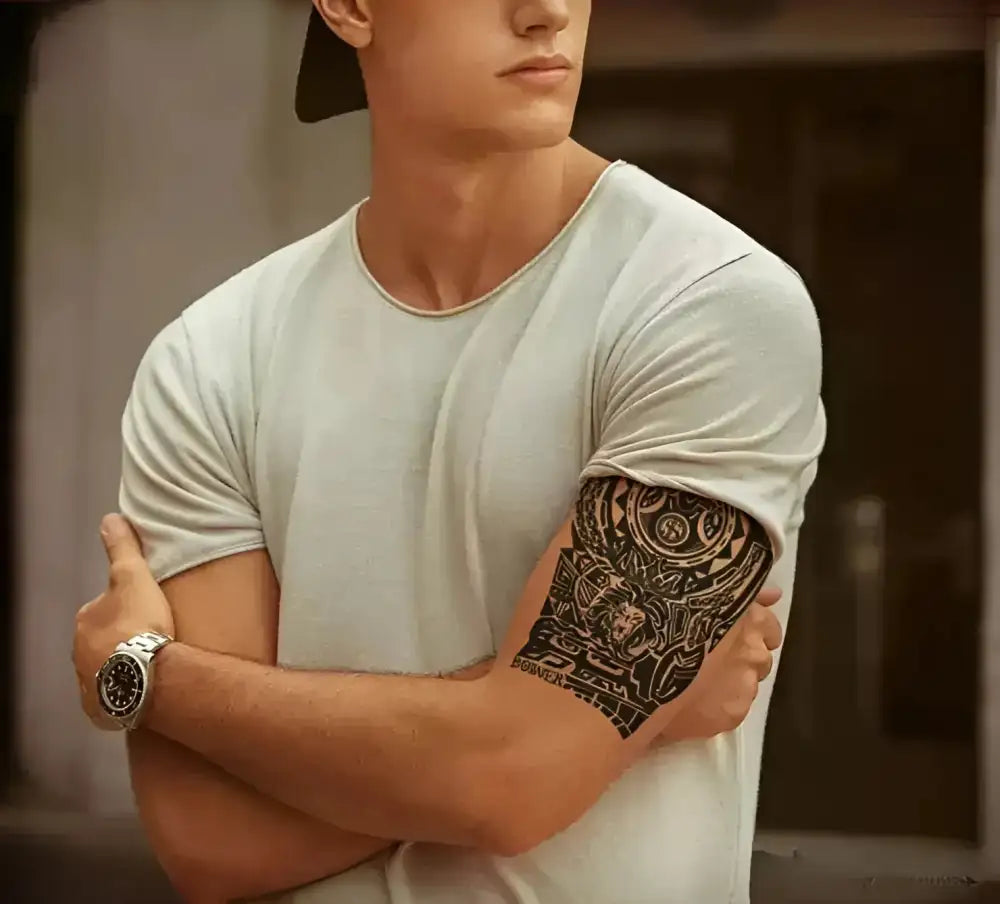 Man with tribal lion tattoo sticker in light T-shirt and watch