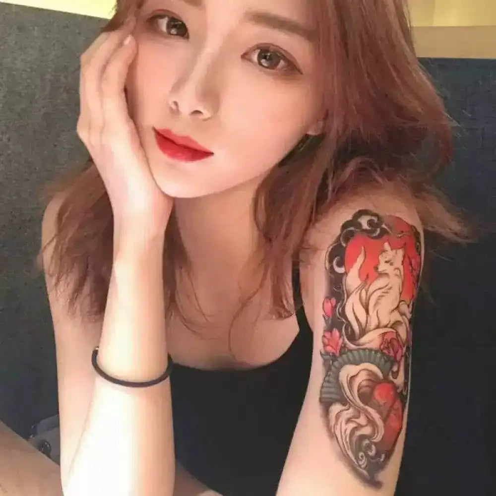 Young woman with Reddish-brown hair showcasing Mystical Fox Temporary Tattoos with floral design