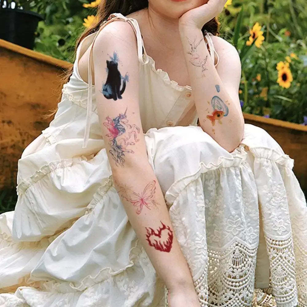 Woman in white dress with purple floral small tattoo stickers on arms
